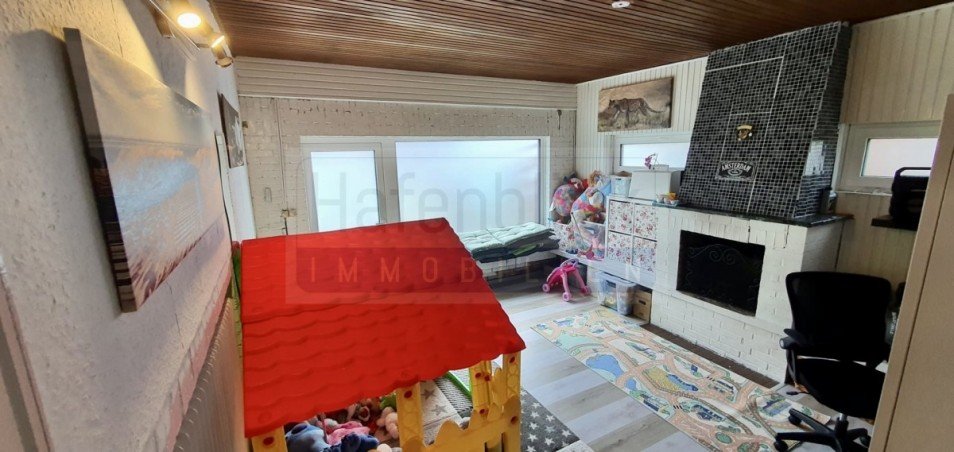 Kaminzimmer mit Zugang zum Garten Einfamilienhaus Rendsburg